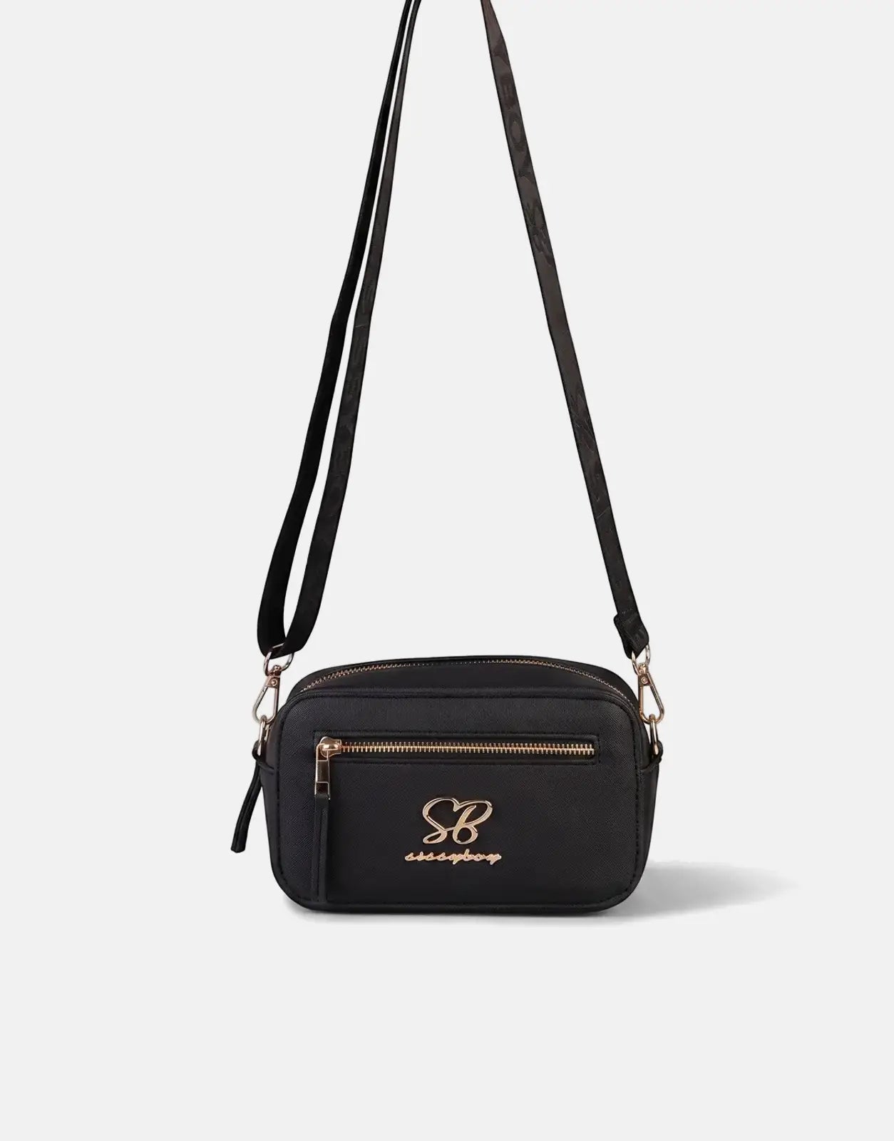 Sissy Boy Basic black faux leather camera bag with gold hardware and logo, suspended against a light background.