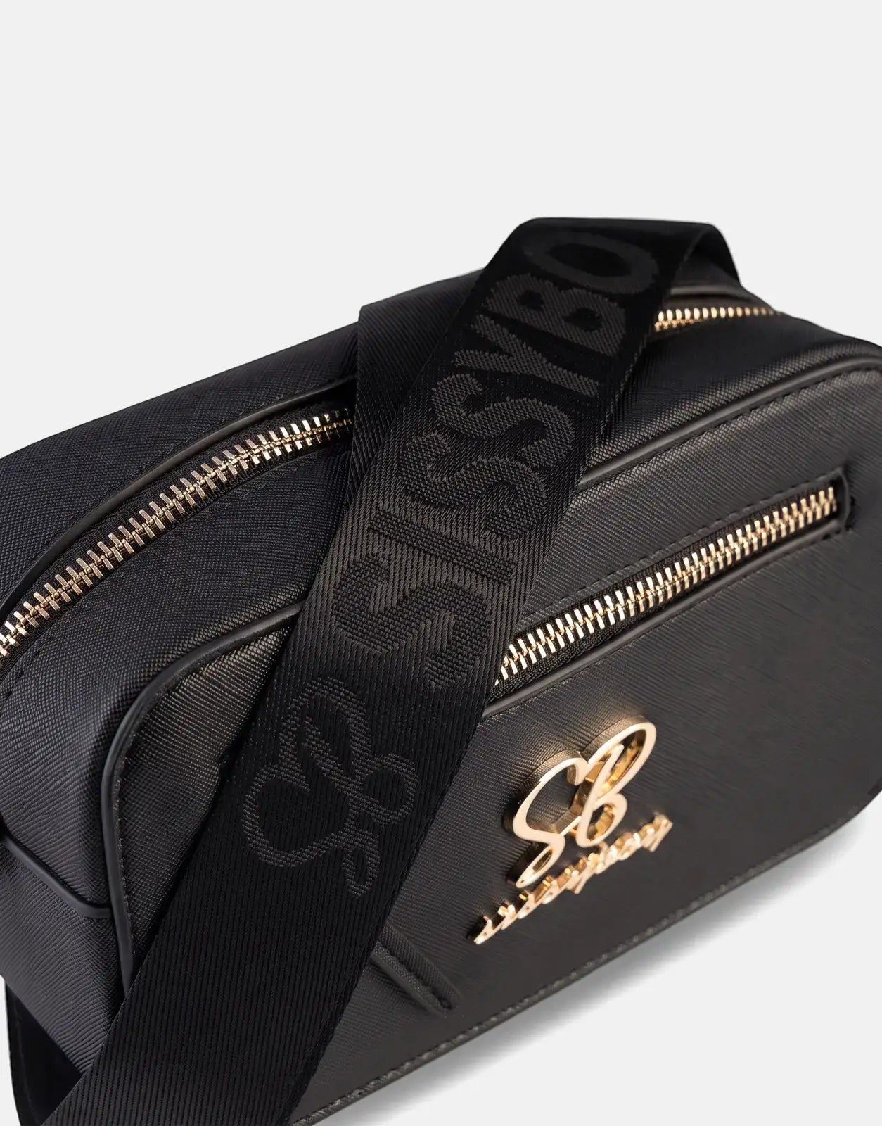 Sissy Boy Basic Black Camera Bag with gold zippers and prominent logo, displayed at an angle.