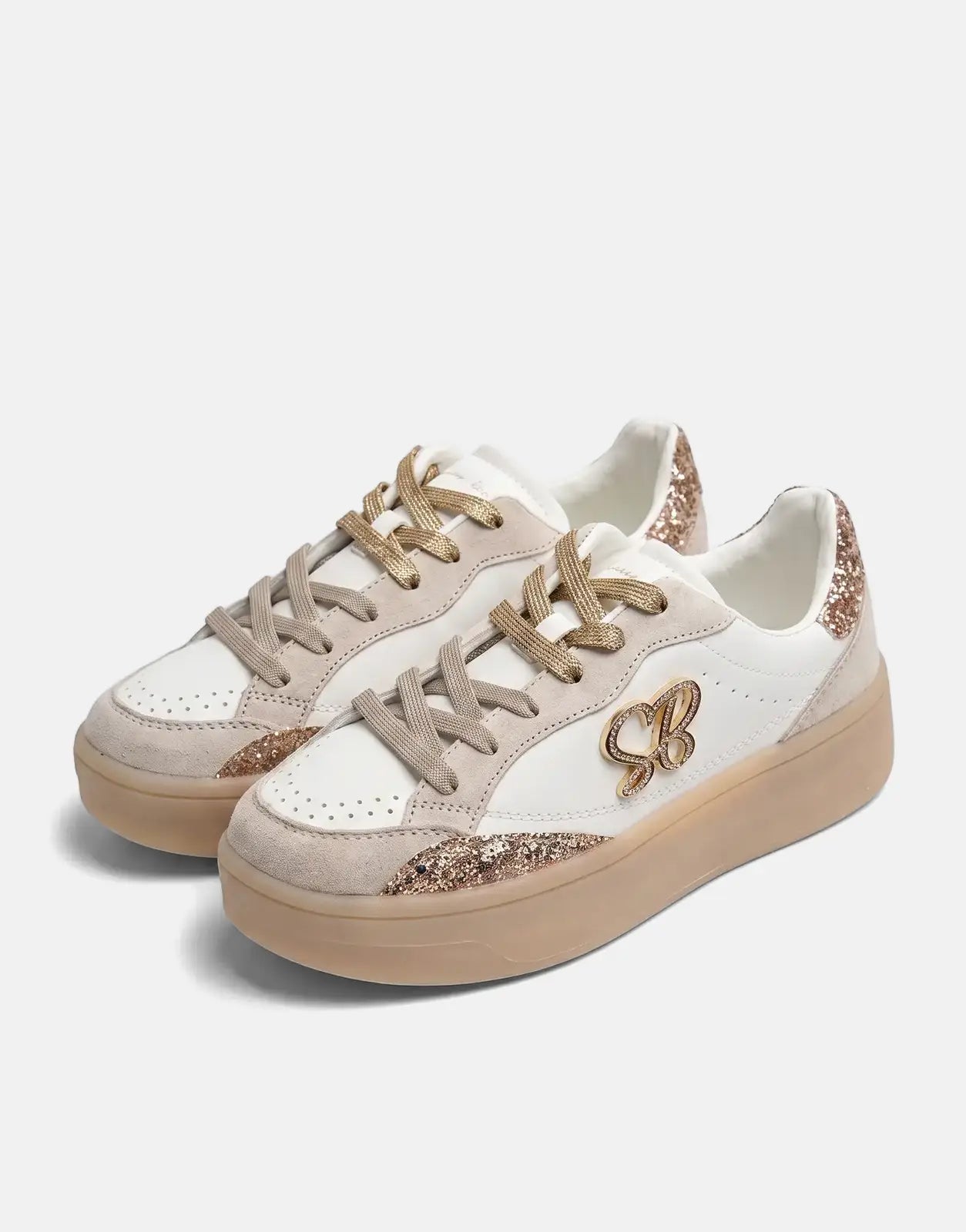 Pair of Sissy Boy Blaine white and gold platform sneakers with glitter accents and beige soles, displayed on a light surface.