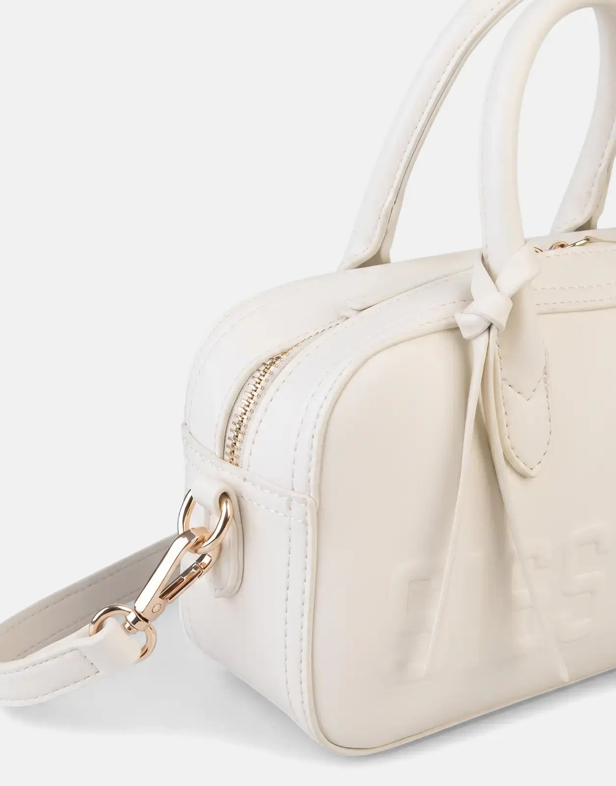 Close-up of an off-white Sissy Boy Emory structured shoulder bag with dual top handles, a gold zipper, and gold hardware.