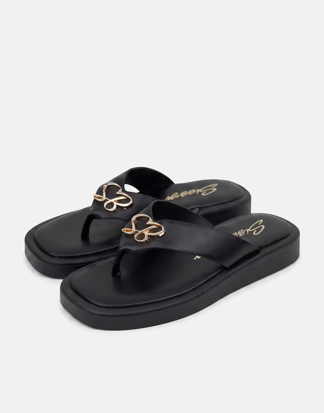 A pair of Sissy Boy Mimi black thong sandals with platform soles and gold heart-shaped embellishments on the straps, viewed