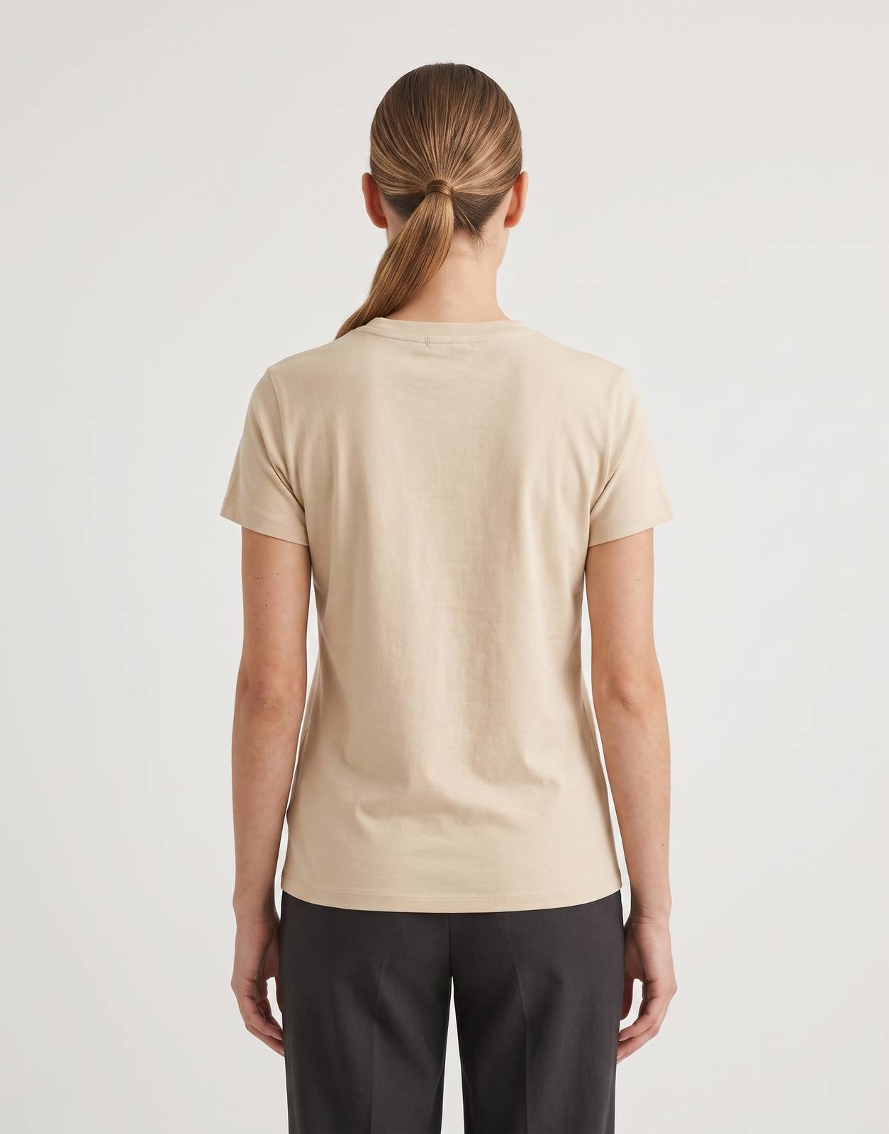 Back view of a Sissy Boy Rumours Regular T-Shirt in soft beige, crafted from smooth knit fabric with short sleeves and a
