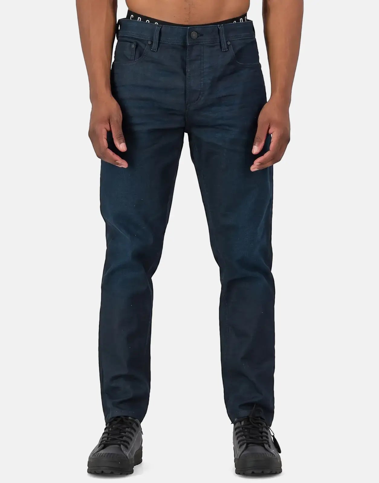 Dark blue SPCC Aphotic men's jeans with a straight fit, featuring classic five-pocket styling and a button closure, worn by