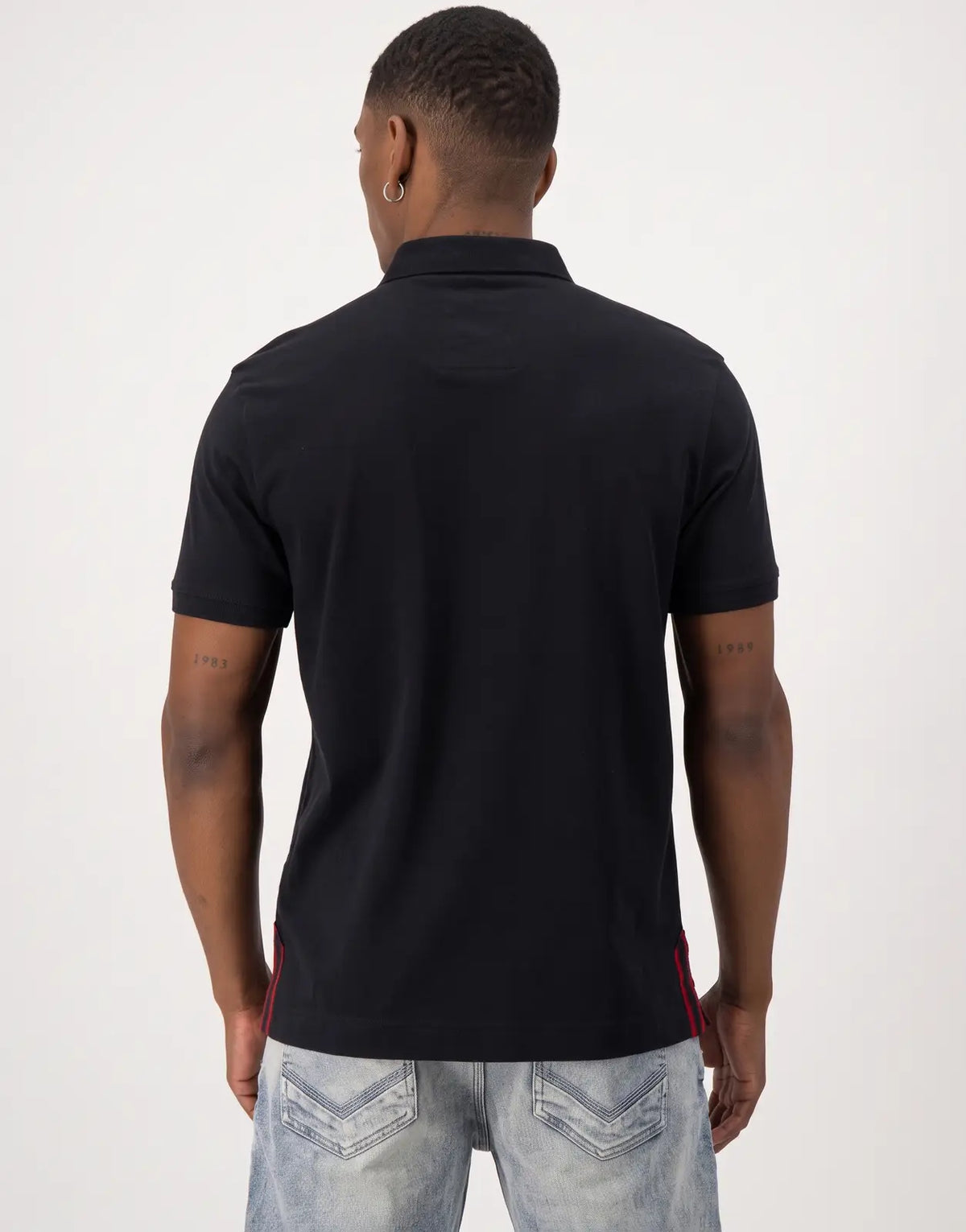 Black SPCC Roarke Golfer men's short-sleeve polo shirt, shown from the back, highlighting the garment's design and fit.