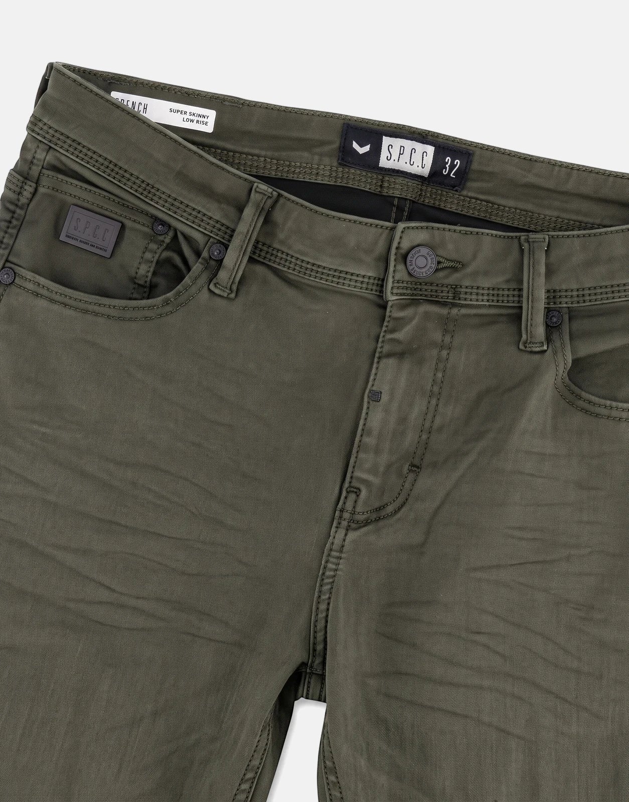 Close-up front view of olive green SPCC Rodan Redrafted Fatigue Jeans, showcasing the fly, pockets, and branded details.