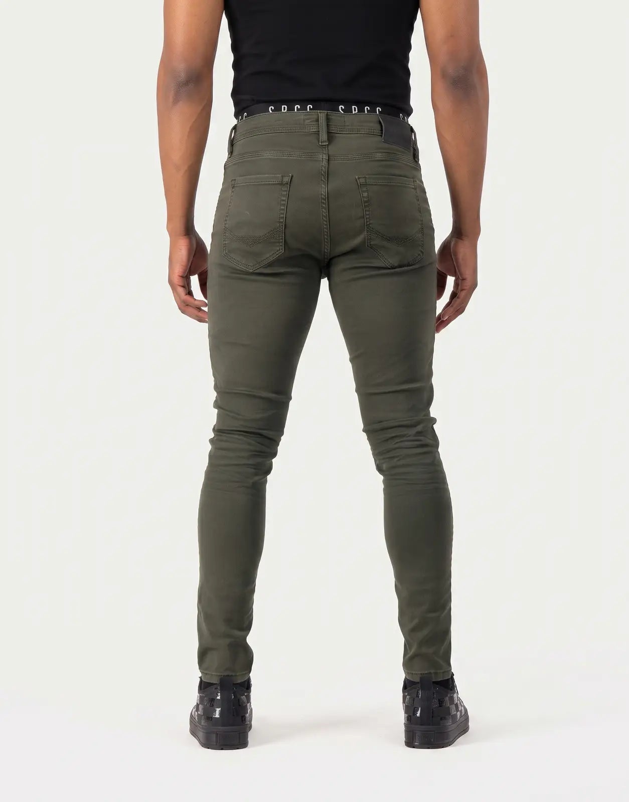 SPCC Rodan Redrafted Fatigue Jeans for men in olive green, featuring a skinny fit and rear pocket details, viewed from the