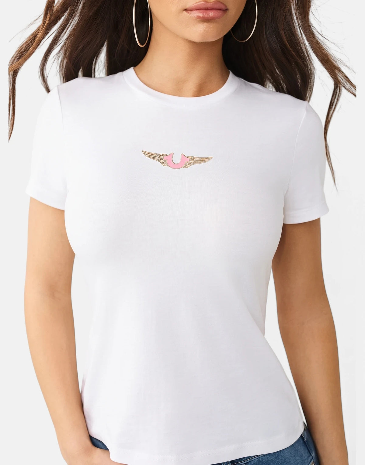 A white True Religion HS Wing T-Shirt for women, featuring a distinctive pink horseshoe logo with gold wing details on the