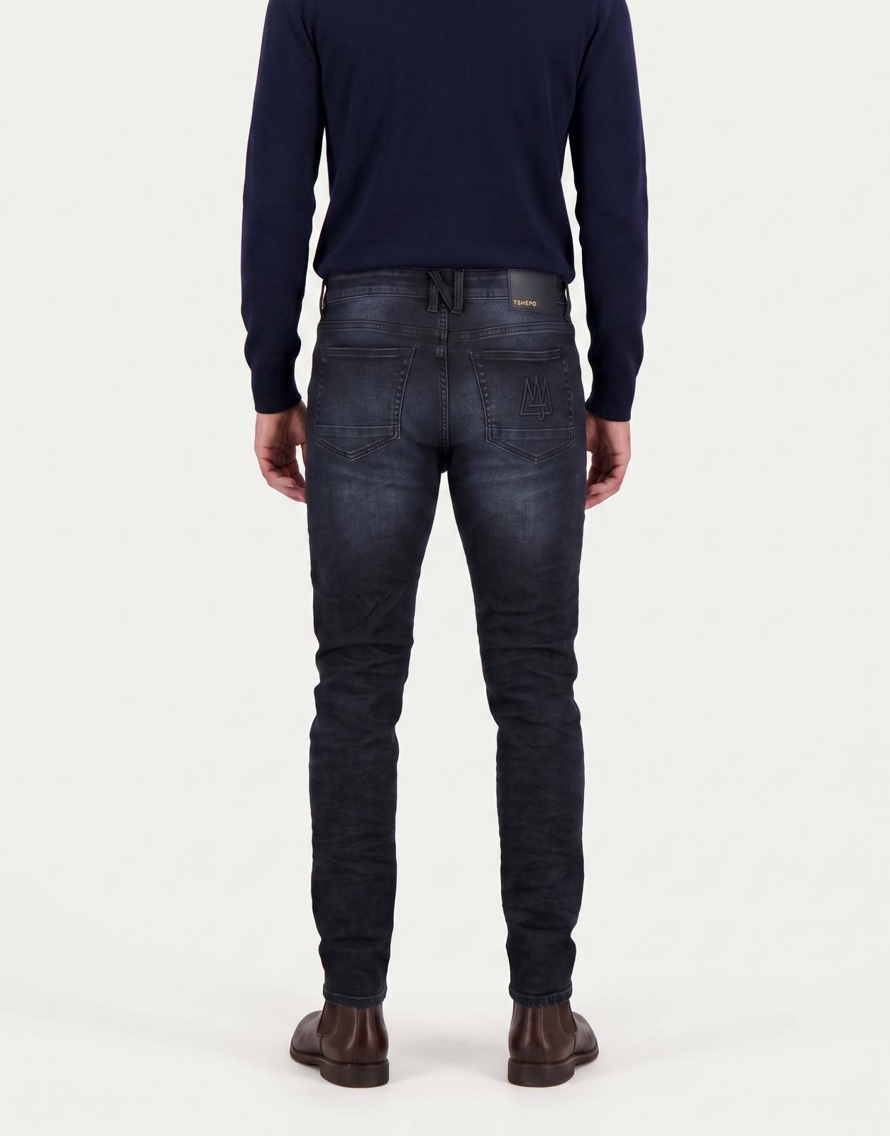 TSHEPO Takalani C1 Mid Indigo Jeans for men, shown from the back. These slim-fit denim jeans feature a dark wash and