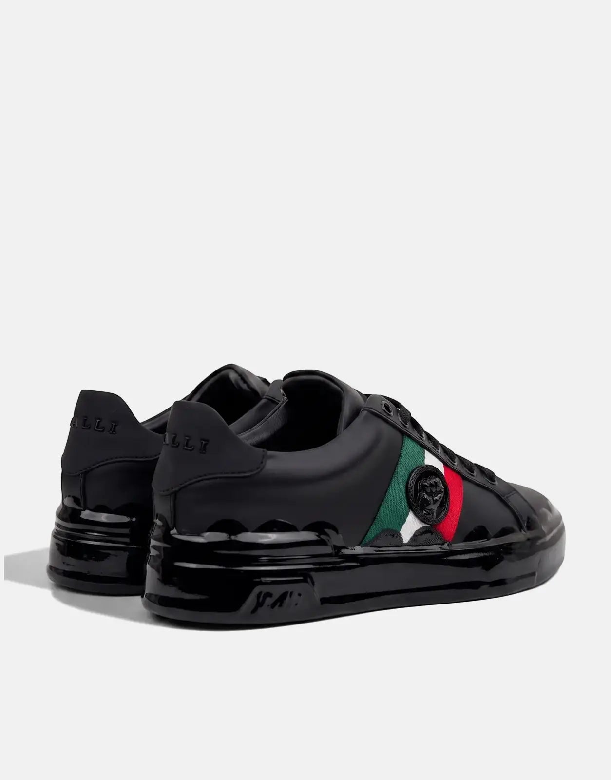 A pair of black Vialli Rubai sneakers featuring glossy and matte leather, green, white, and red side stripes, and an