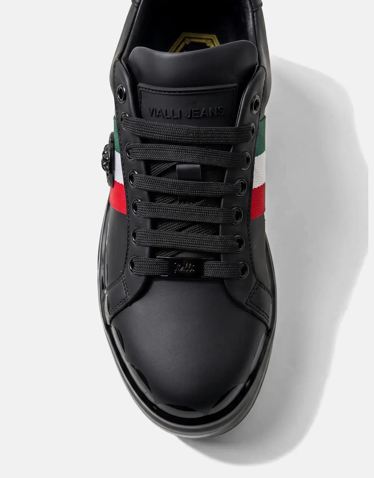 Close-up front view of a black Vialli Rubai leather sneaker with red, white, and green striped detail and black laces.
